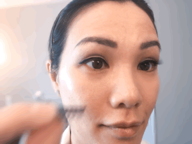 Woman putting on magnetic eyelashes